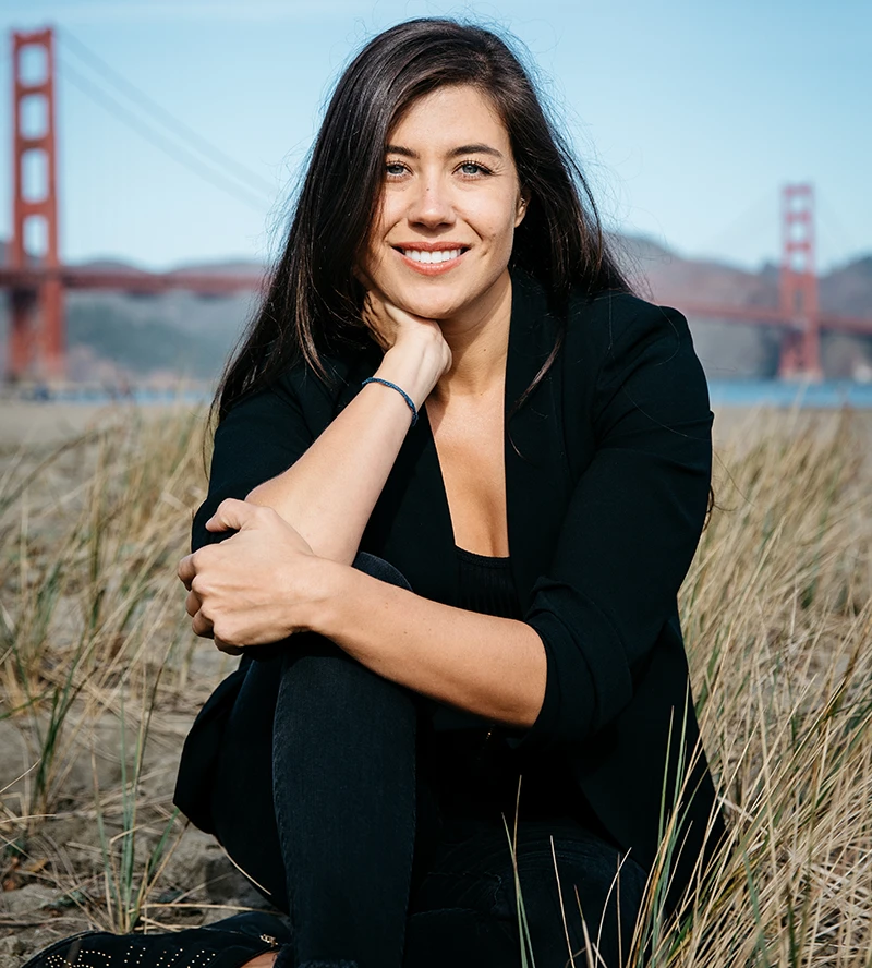 Photo of Tara on the beach in San Francisco, smiling