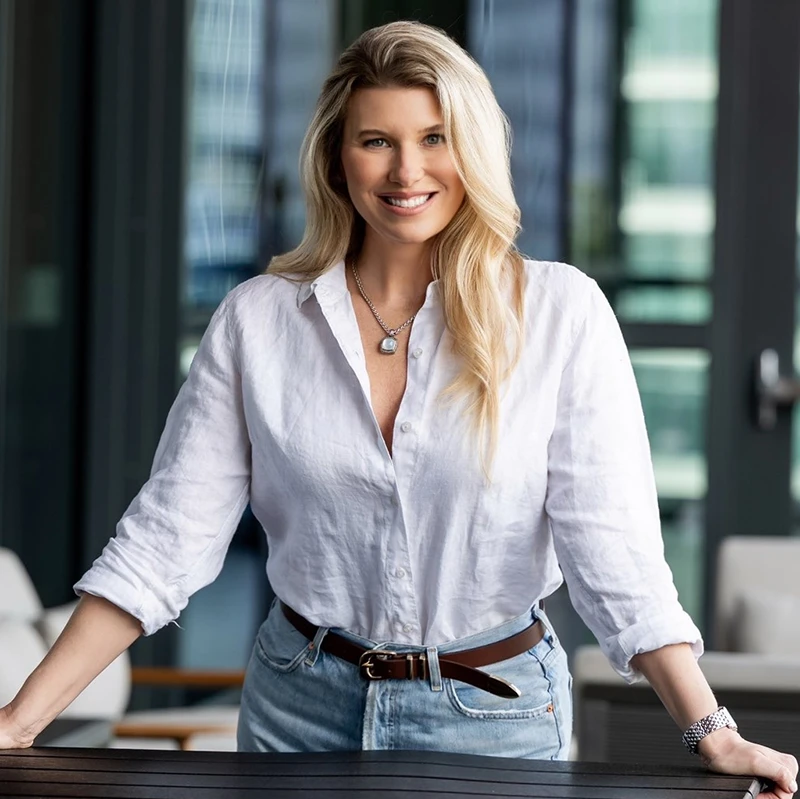 Photo of Ash in a white shirt, smiling