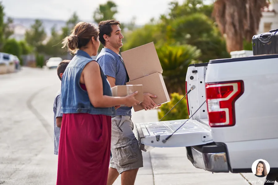Man loading boxes into a car