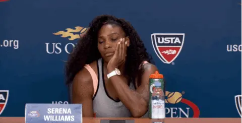 Serena Williams at a press conference, shrugging, with the text "Just Being Honest" on the screen