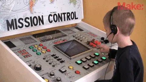 Gif of a small kid operating a big complex machine