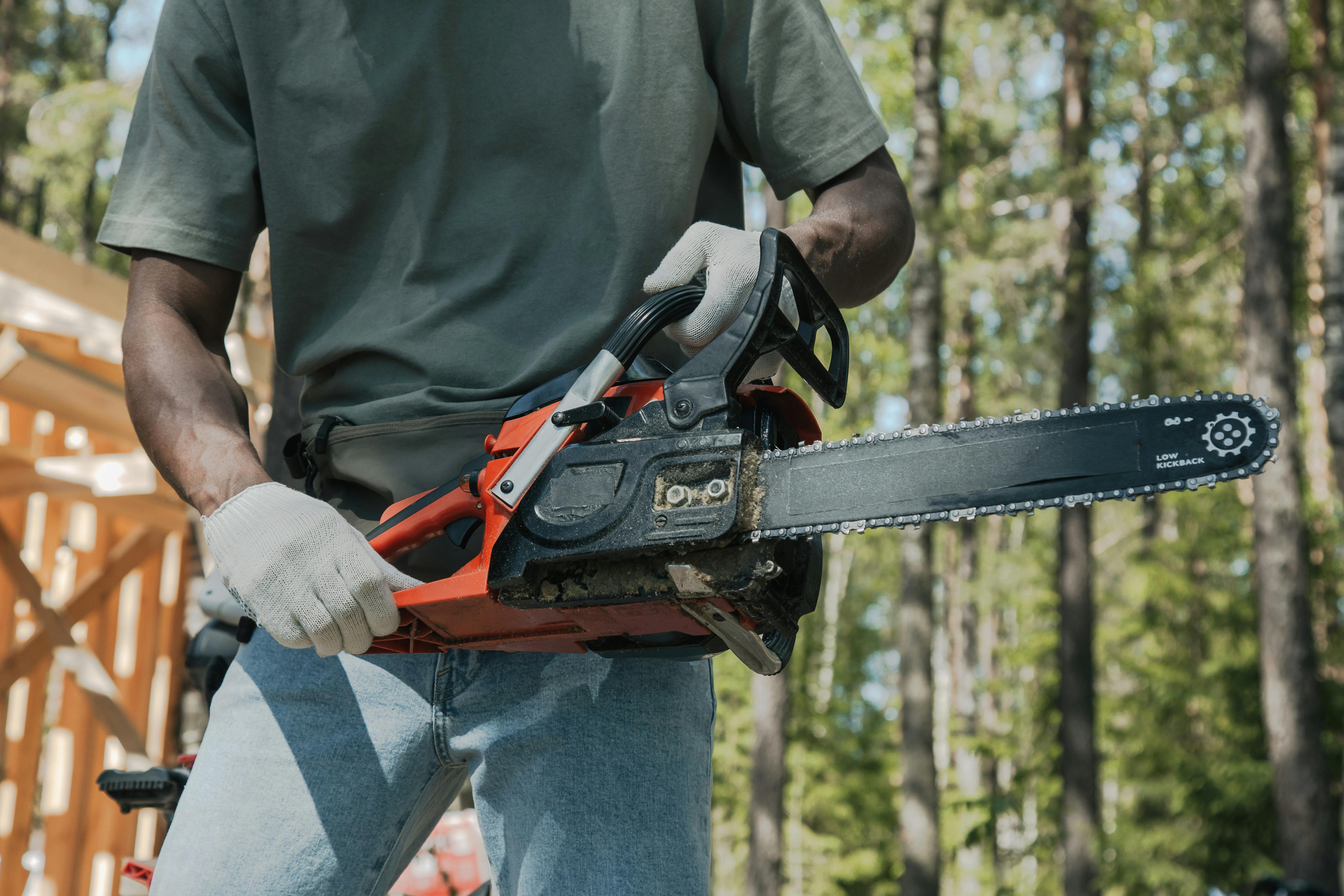 Man holding a chainsaw