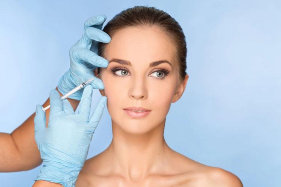 Cosmetic provider administering an injection near the under-eye area, illustrating PRP injections vs. fillers for under-eye rejuvenation and treatment comparison