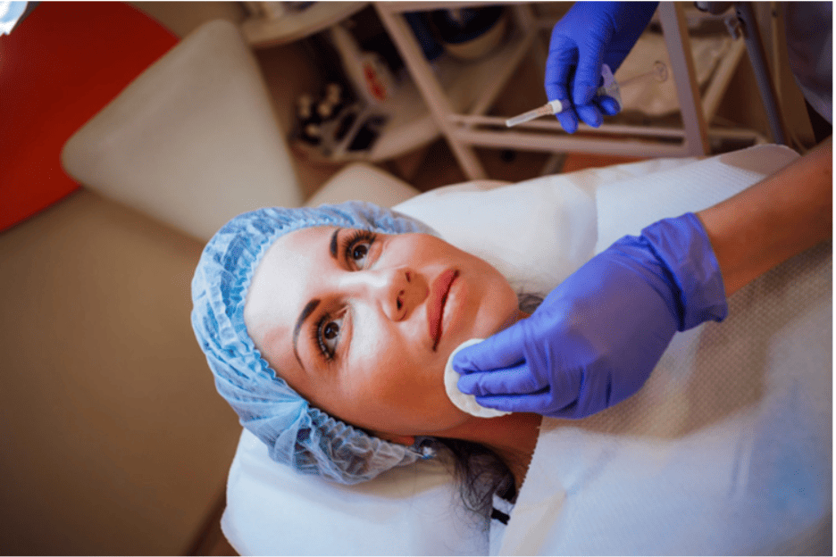 Cosmetic provider administering an injection near the under-eye area, illustrating PRP injections vs. fillers for under-eye rejuvenation and treatment comparison