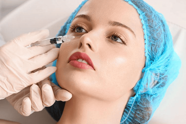Close-up of a woman receiving a cosmetic injection, illustrating Botox treatments and possible touch-up appointments. 