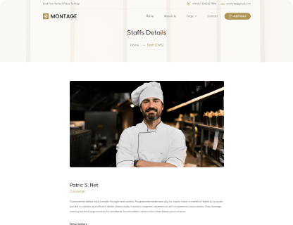 Smiling male chef in white uniform and hat standing with arms crossed in a restaurant kitchen.