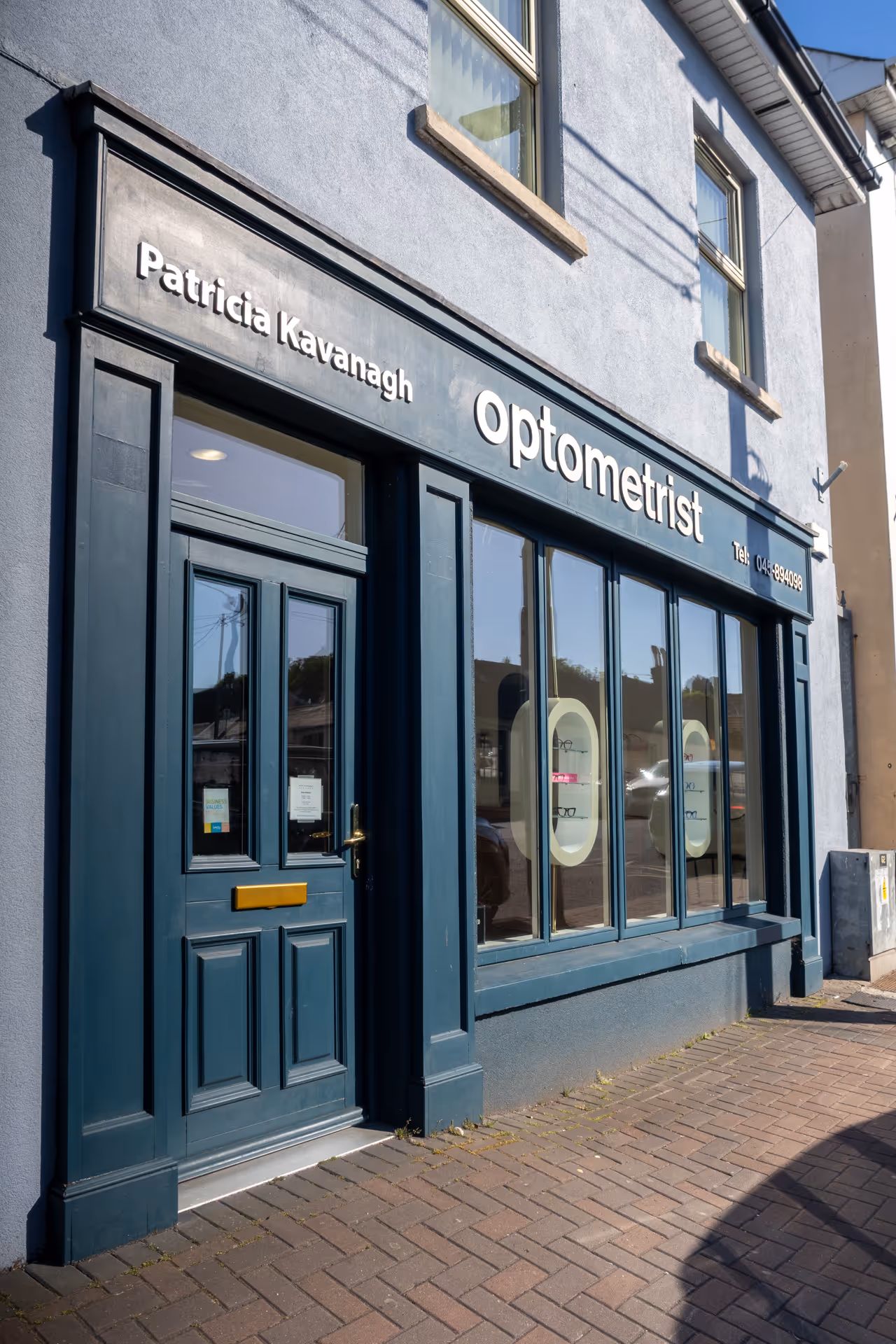 Patricia Kavanagh Optometrist storefront with blue-gray exterior