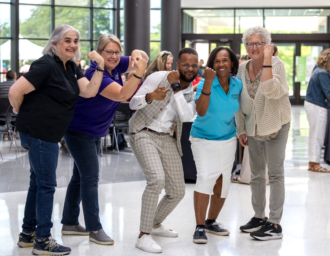 A team showing their Fear(less) bands after the keynote.