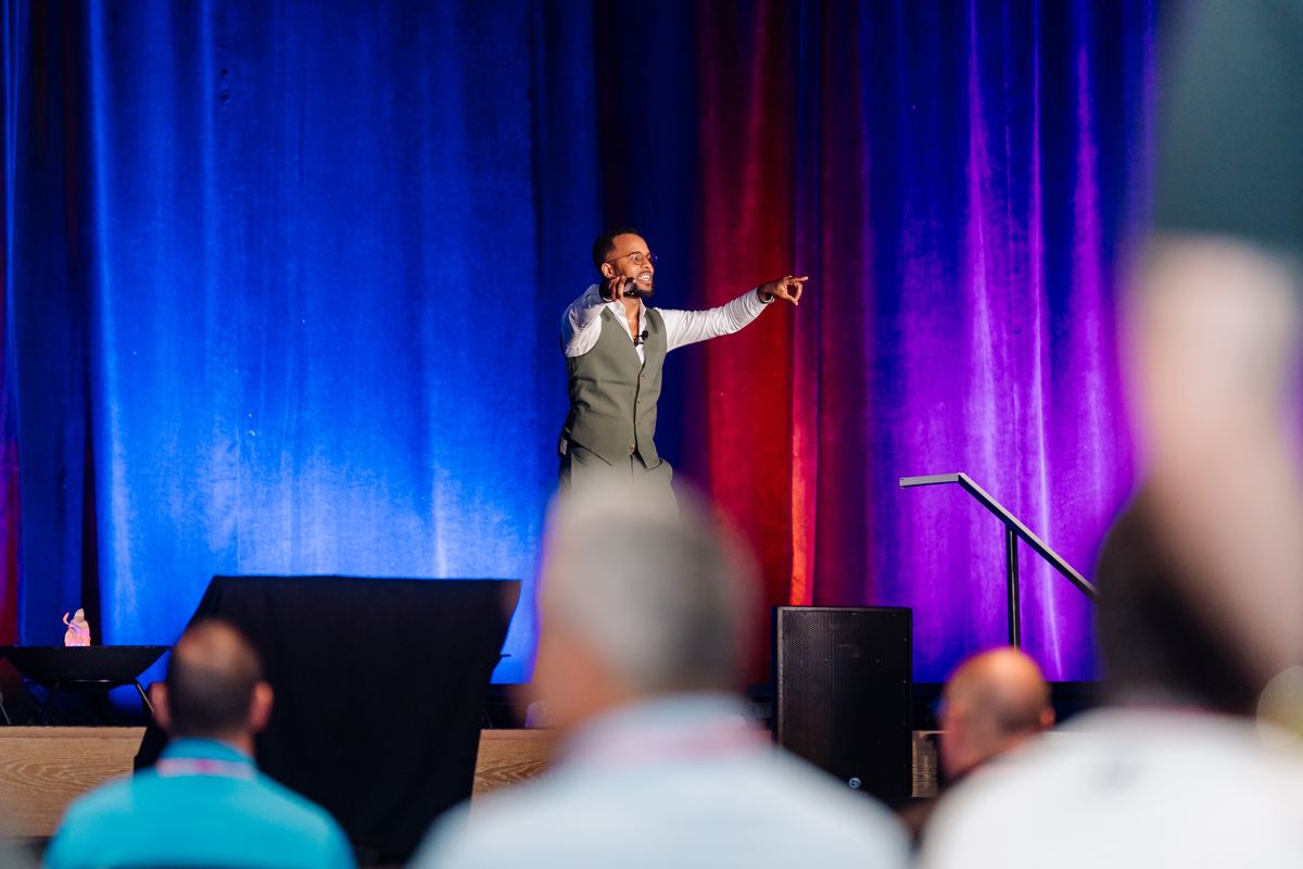 Darryl on stage at a national education conference