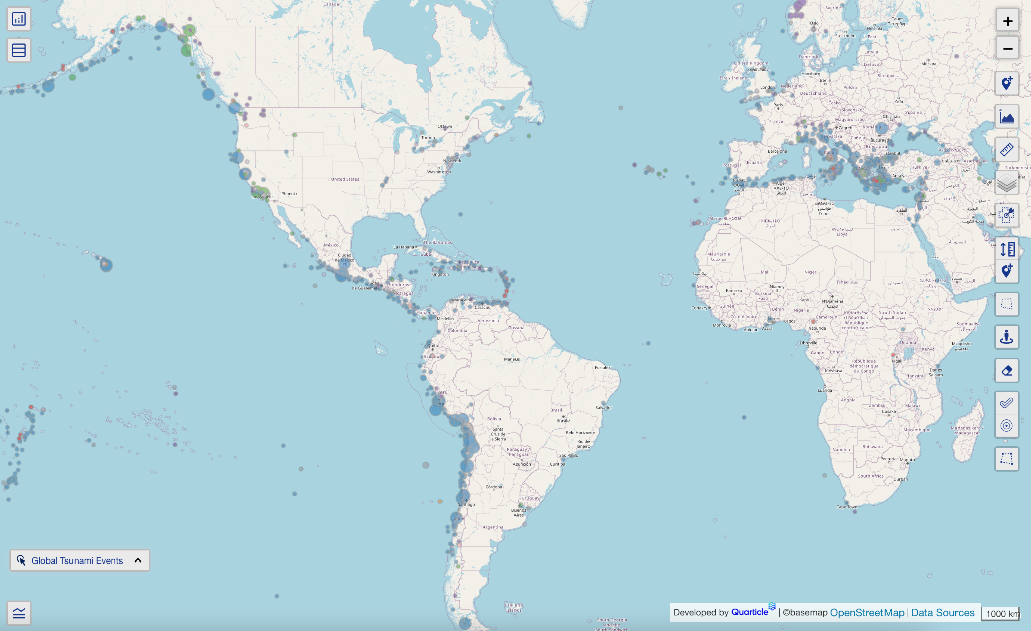 Graph by Quarticle displays the global distribution of NOAA tsunami events, with event causes represented by colour and event intensity shown through varying point sizes.