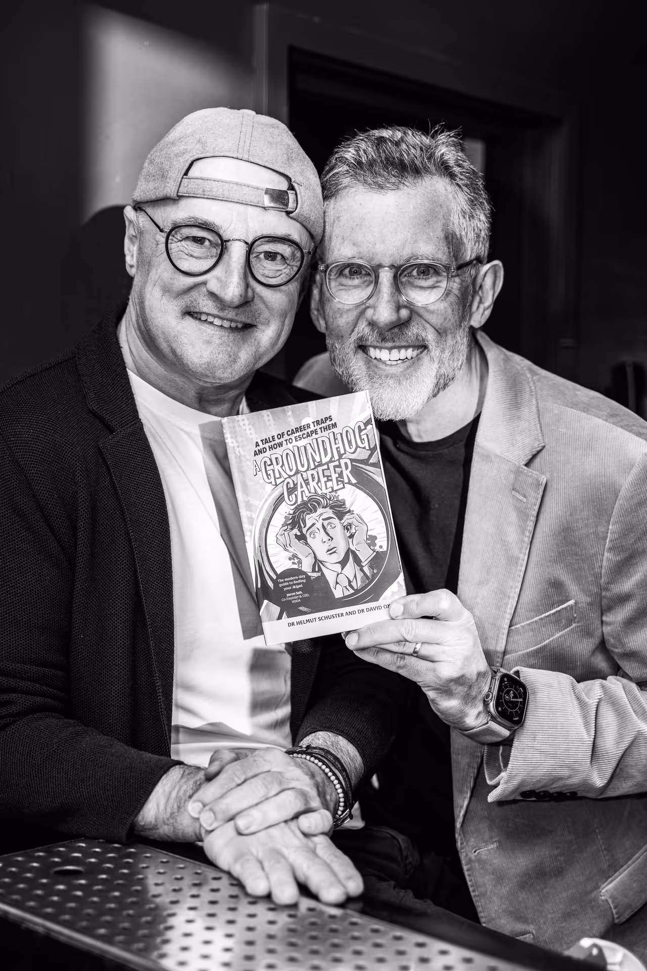 Dr Schuster and Dr Oxley holding their book a groundhog career