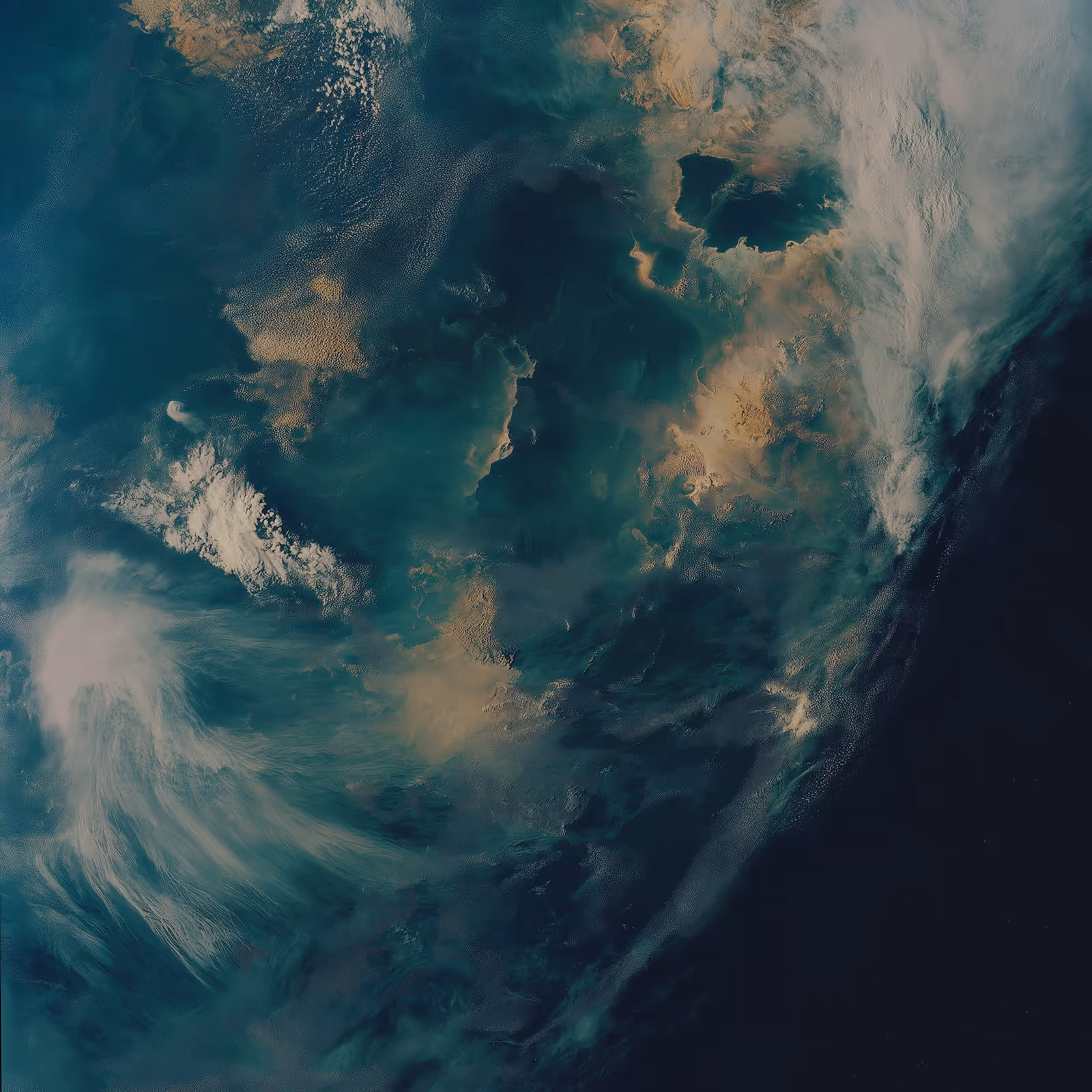 Planet Earth view from the space showing a mix of clouds and sea.