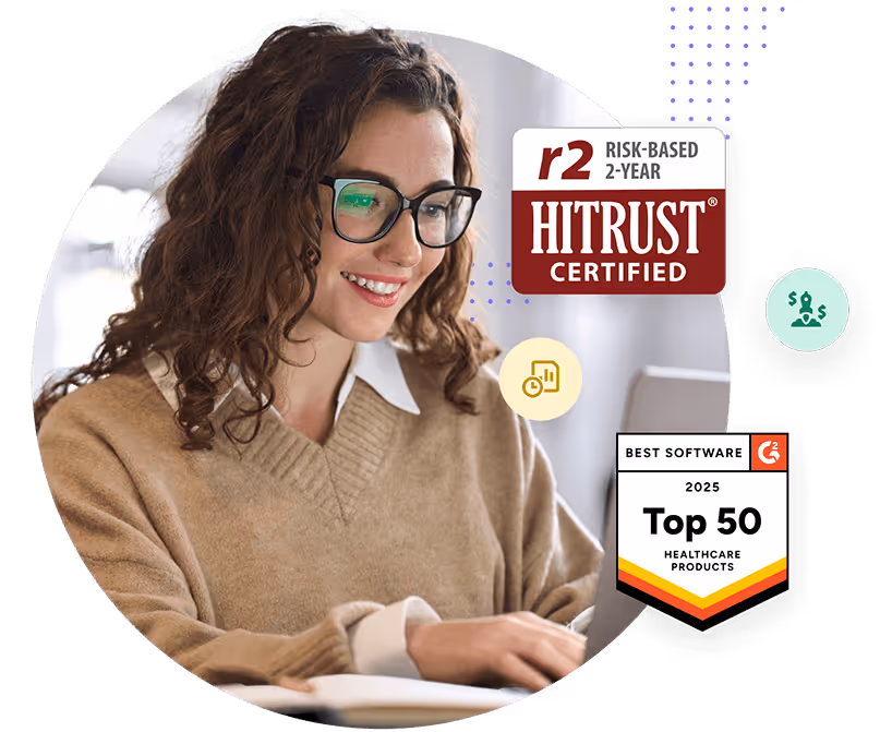 A woman wearing glasses is looking at a laptop.