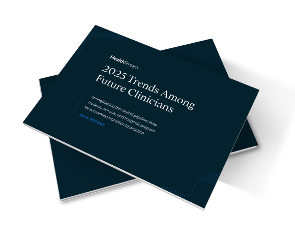 Stack of dark blue booklets titled '2025 Trends Among Future Clinicians' by HealthStream, focusing on clinical pipeline preparation for students and hospitals.