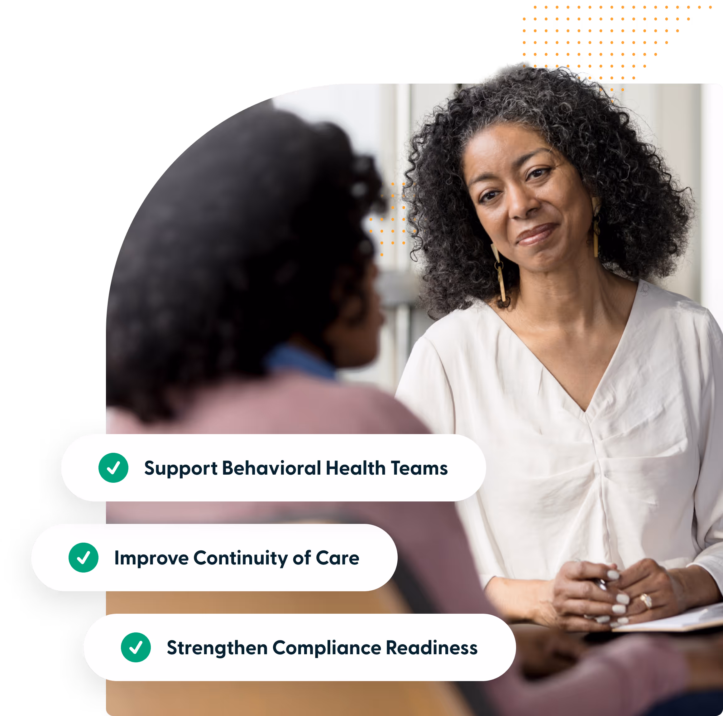 Two women engaged in a supportive conversation with text listing behavioral health team goals.