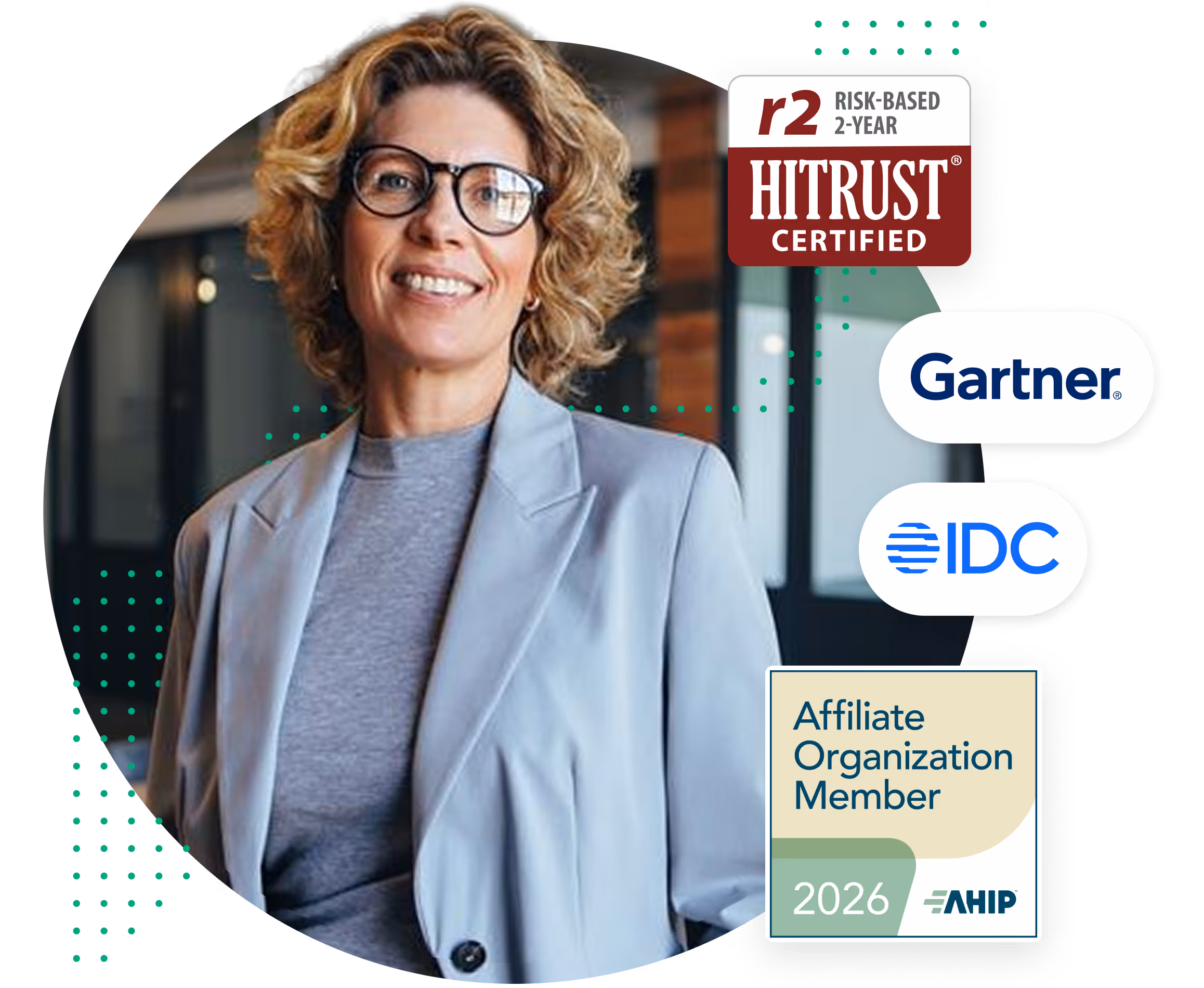 Smiling woman with curly hair and glasses wearing a light blazer with certification and membership logos.