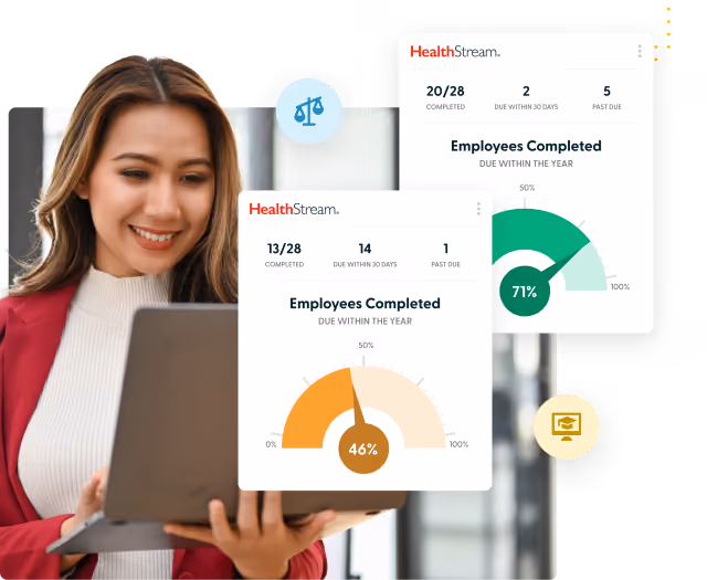 Woman in red blazer looking at laptop with two HealthStream employee completion progress dashboards visible.