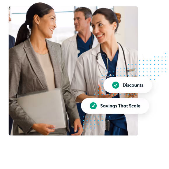 Two smiling women, one in a doctor coat with stethoscope, the other in business attire with folder.