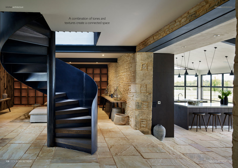 Spiral stairs leading into modern kitchen