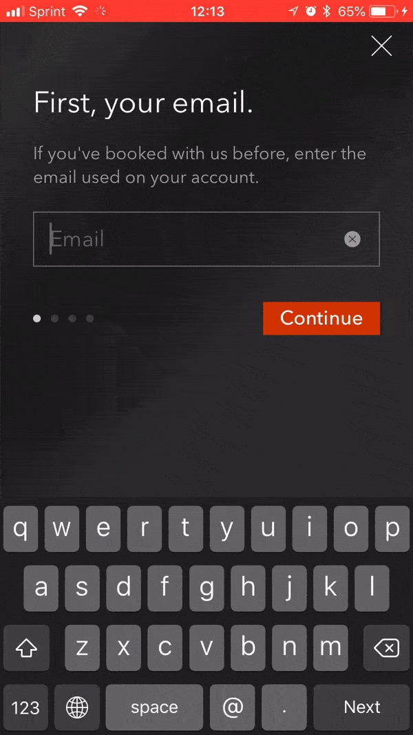 This is an image of a simple login screen that happens at booking. There is a single form field with progress indicators showing the signup process will be short. This is an example of postponing user registration or signin until a logical point in the user journey. 