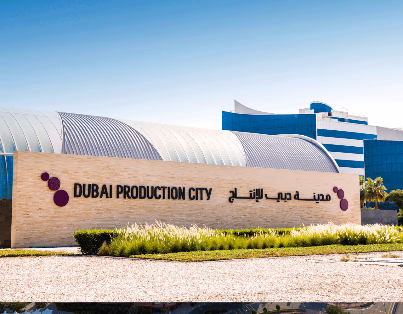 Evening view of Dubai Outsource City from afar Dubai Production City to participate in drupa 2024