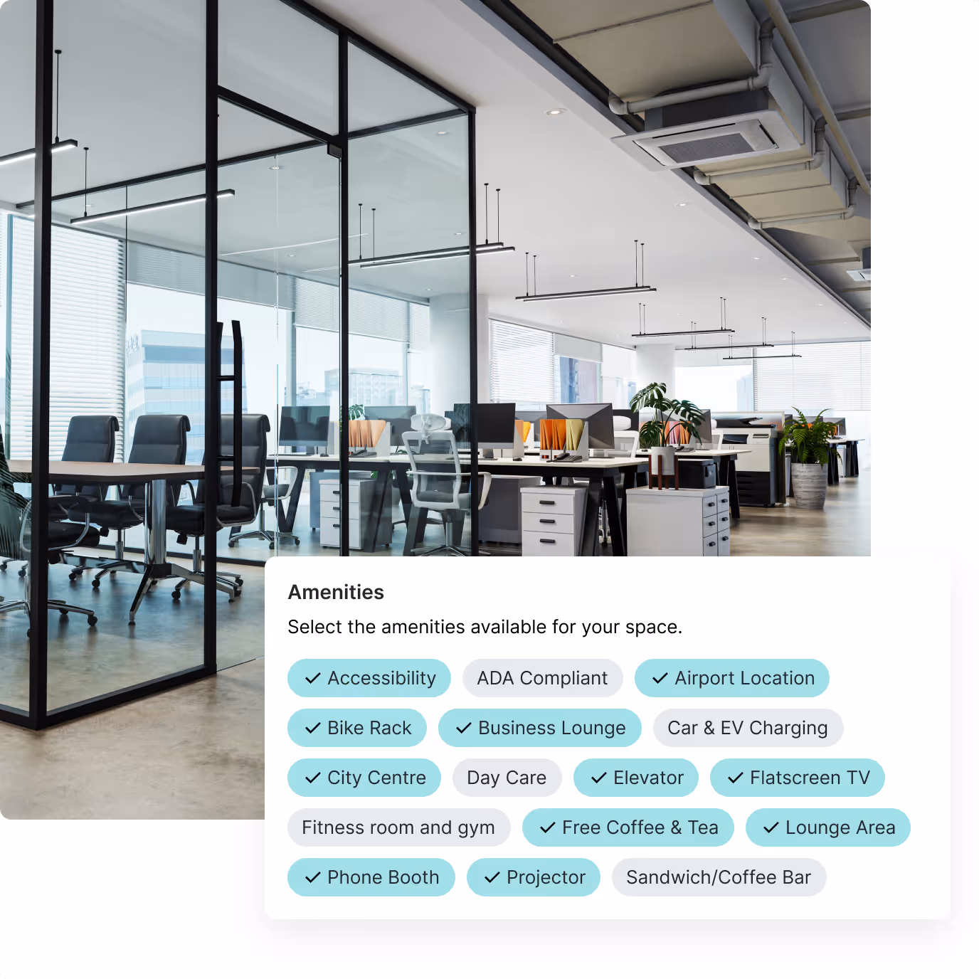 Modern office space with glass-walled meeting room and rows of desks equipped with computers and office chairs.