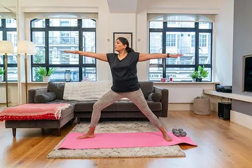 A woman practising Yoga for weight loss