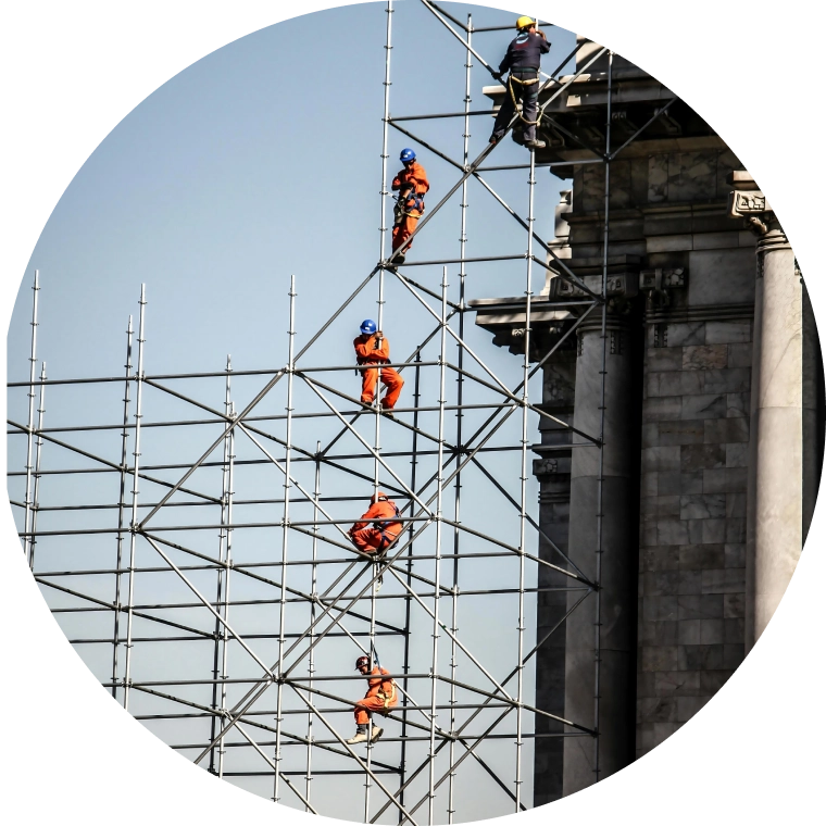 Photo of construction workers on scaffolding
