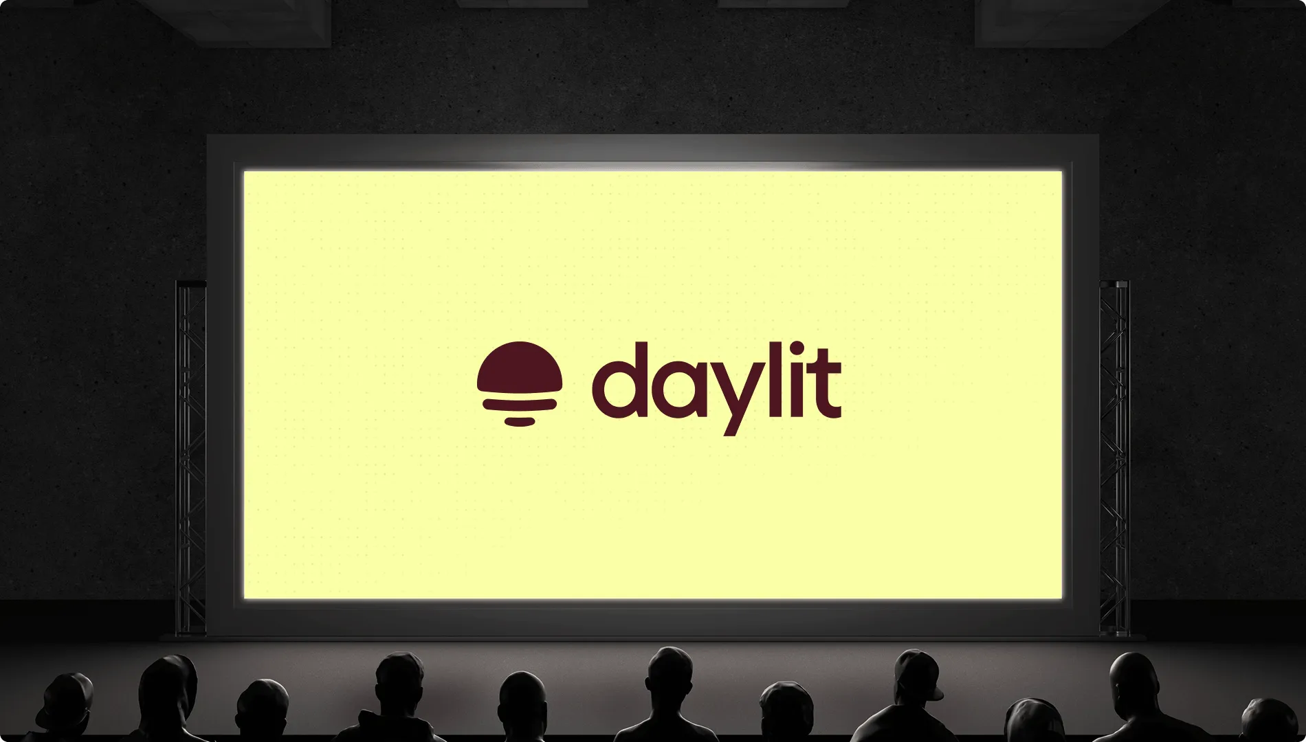 Daylit's new brand is revealed on a large screen
