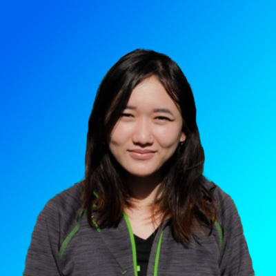 Portrait of a young woman with long dark hair wearing a dark gray jacket over a black top, set against a blue gradient background.