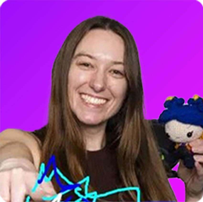 Smiling young man with glasses and dreadlocks wearing a light beige sweater against a bright blue gradient background.