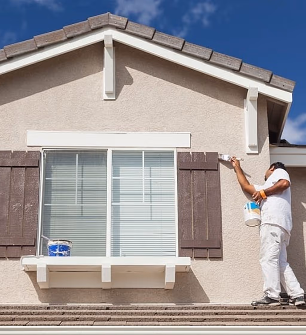 house painter painting exterior walls