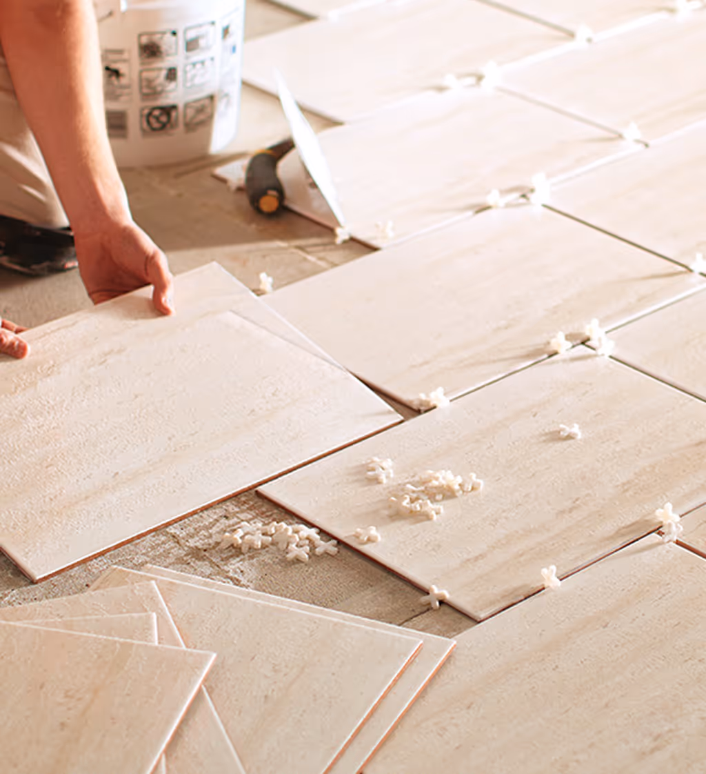 tile installation construction worker