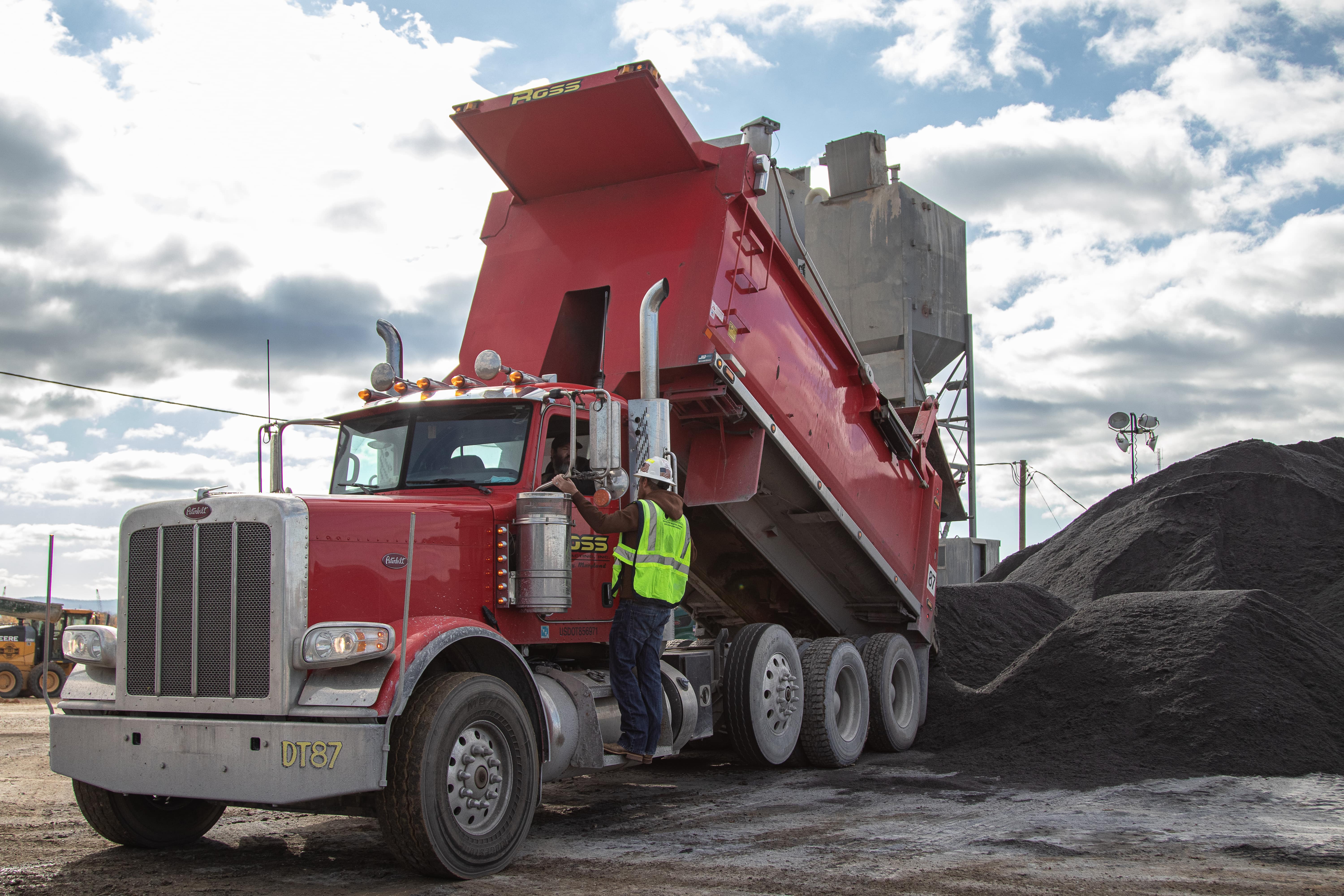 Dump truck Dumping Asphalt
