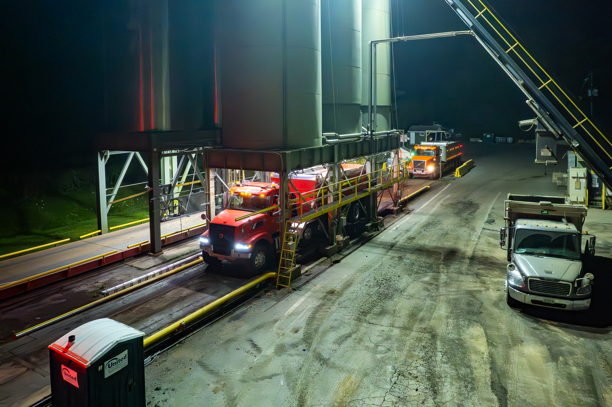 Dump truck receiving asphalt mix