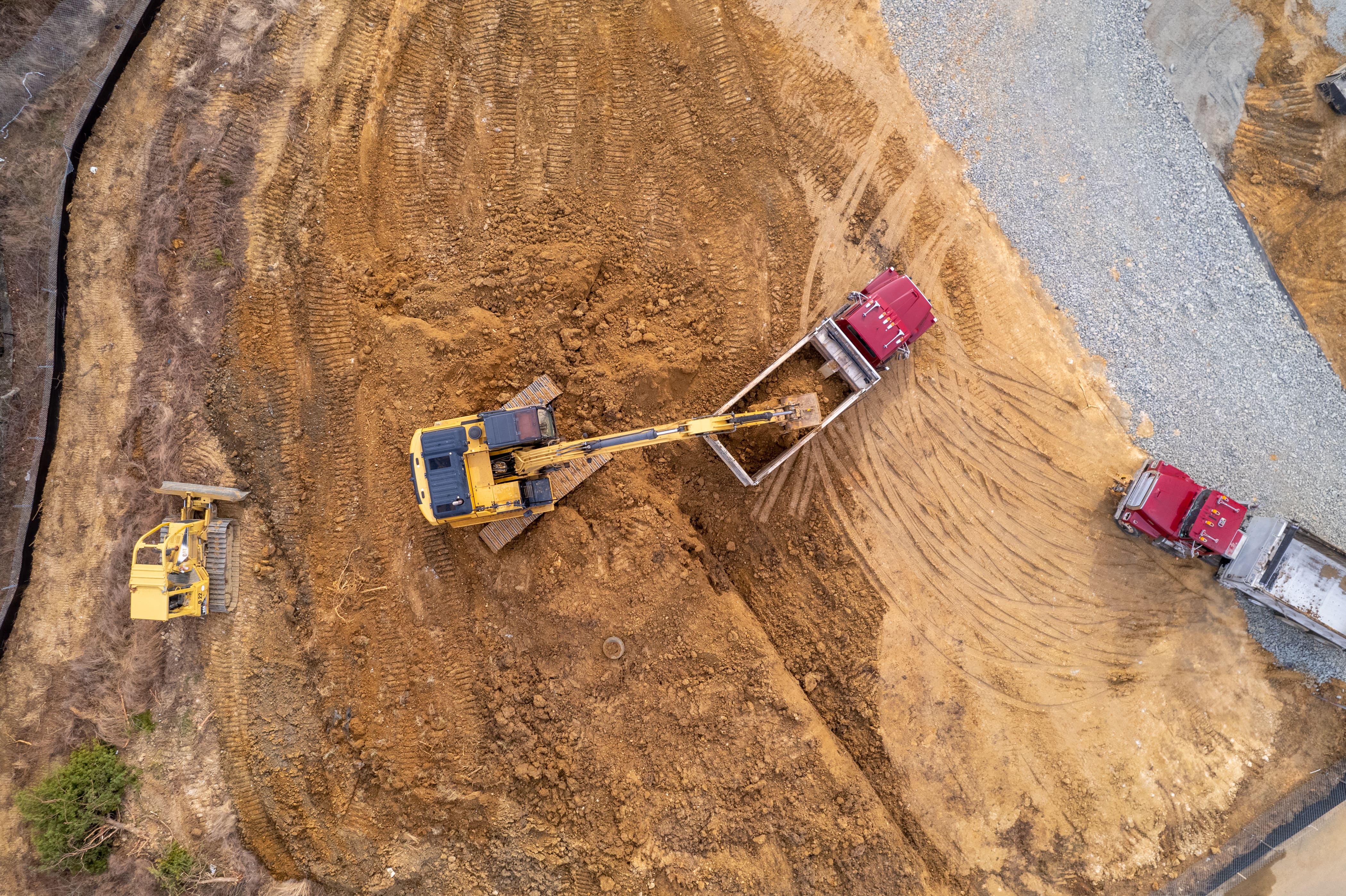 Aerial View of Excavator Loading Dump truck