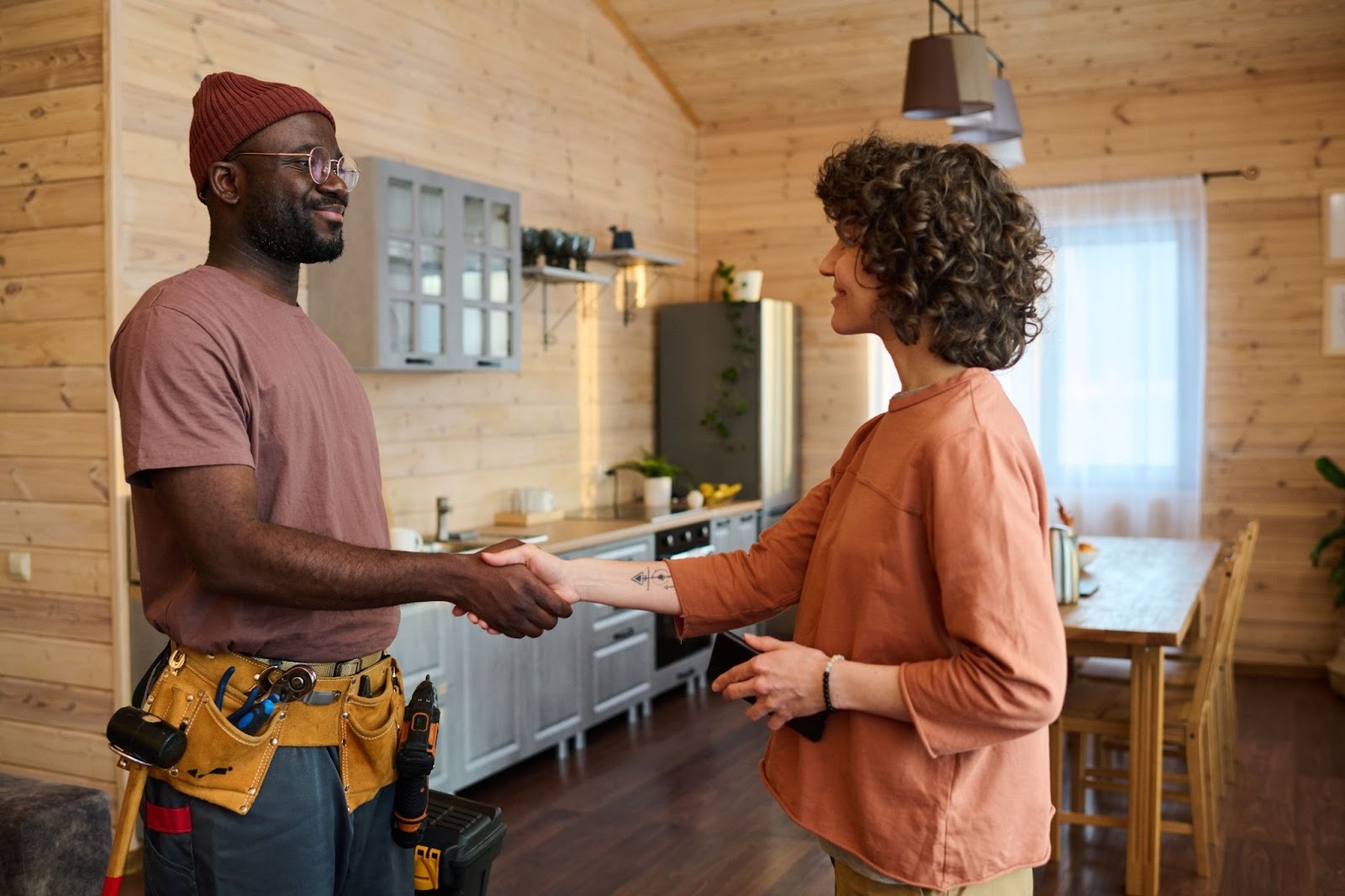 Homeowner shaking hands with a service provider