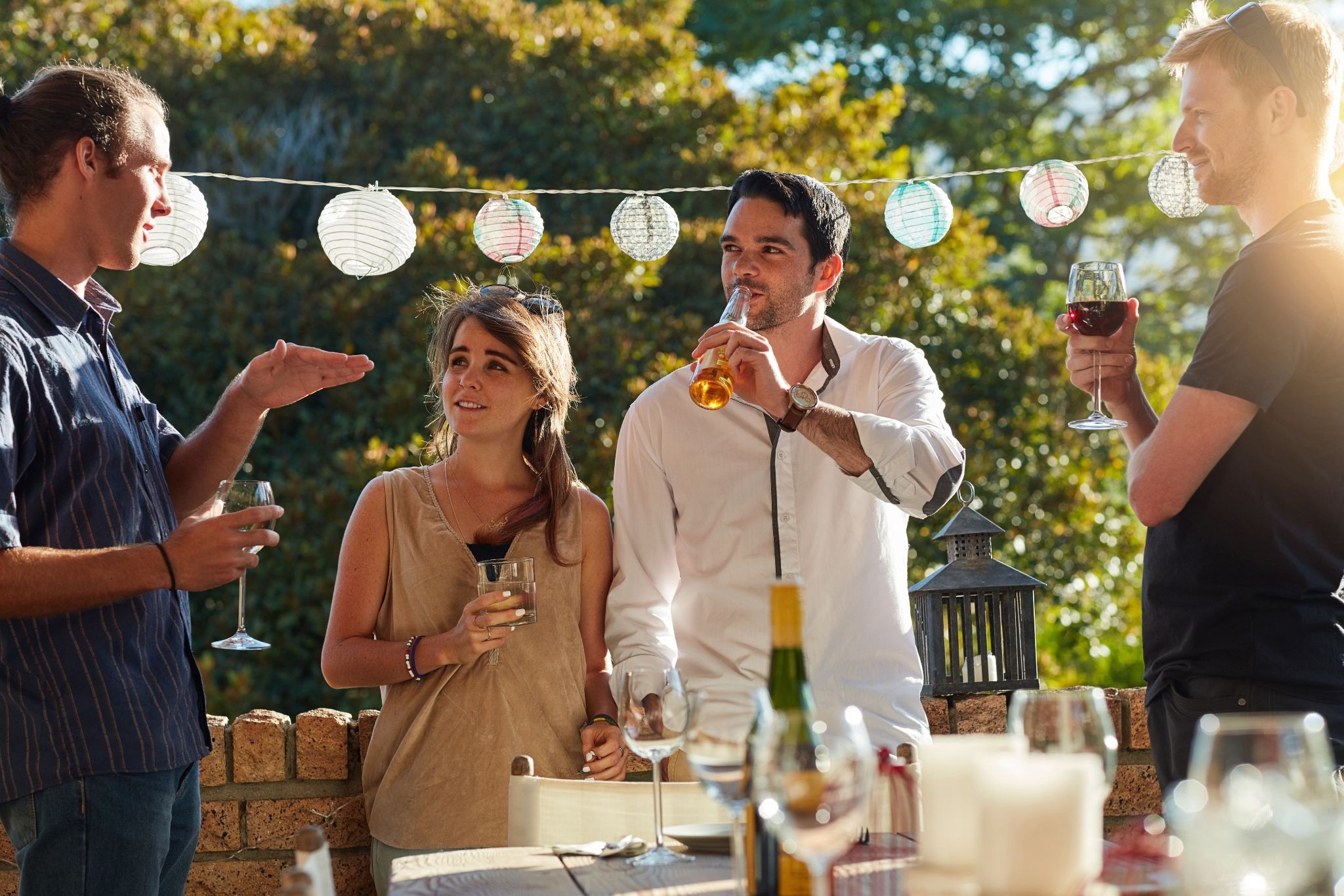 Group of friends enjoying an outdoors get together in the backyard, worry free thanks to uSource Hub.
