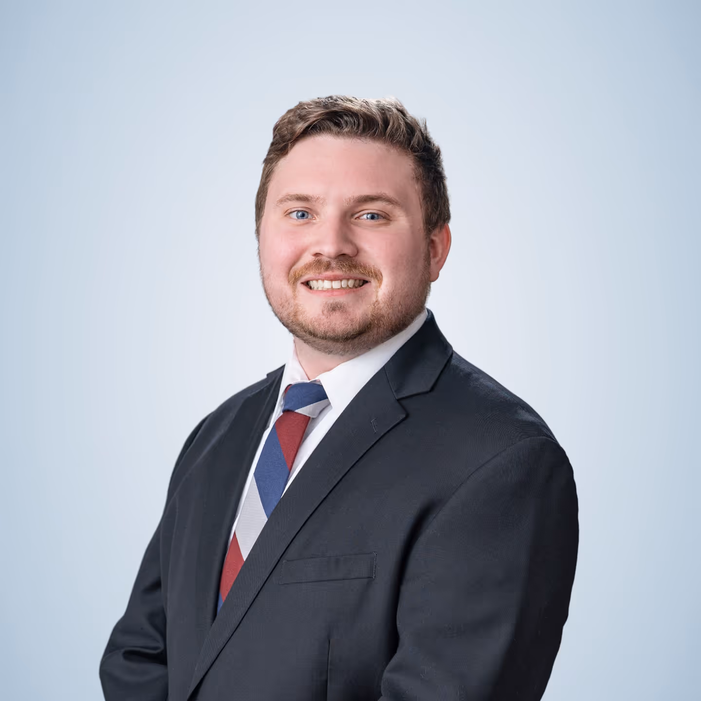 Scott Zurawski, founder and financial advisor of Allied Wealth Planners, posing with a smile and a suit.