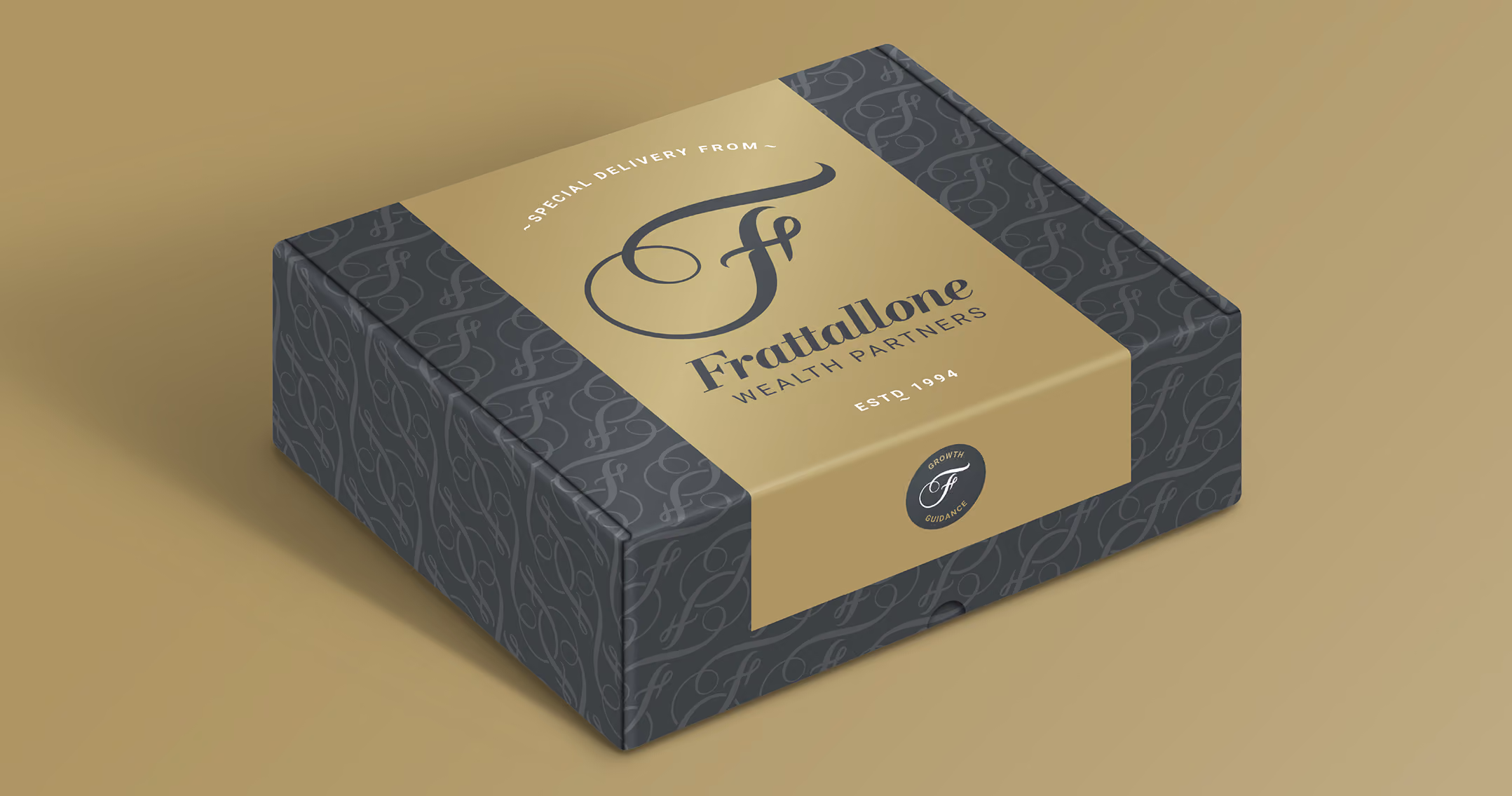 A luxurious box featuring the dark grey branded pattern on the background with a gold label on top that highlights Special Delivery From with the logo beneath it. The side panel mentions Powered by Ameriprise Financial.