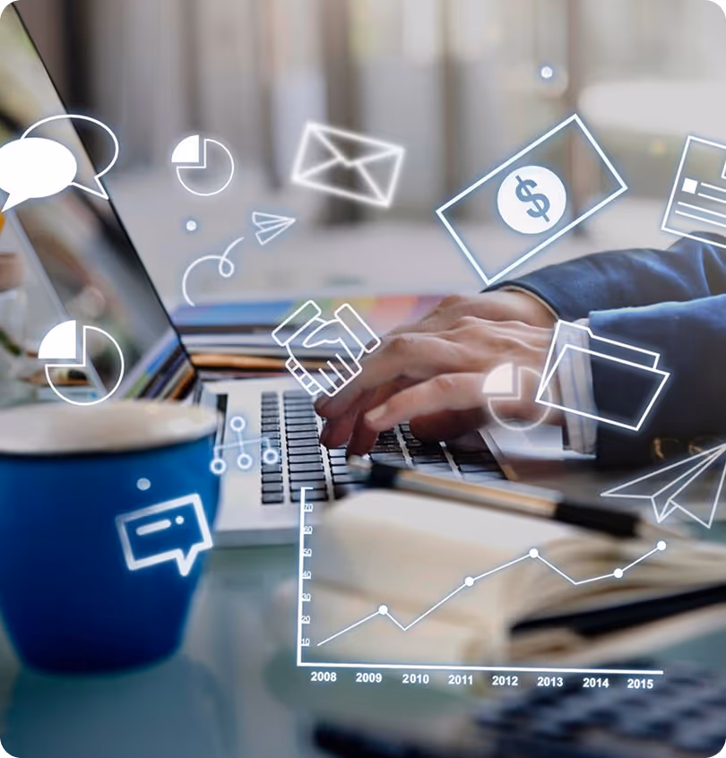 Person typing on laptop with overlaid icons of graphs, money, chat, and envelopes on desk.