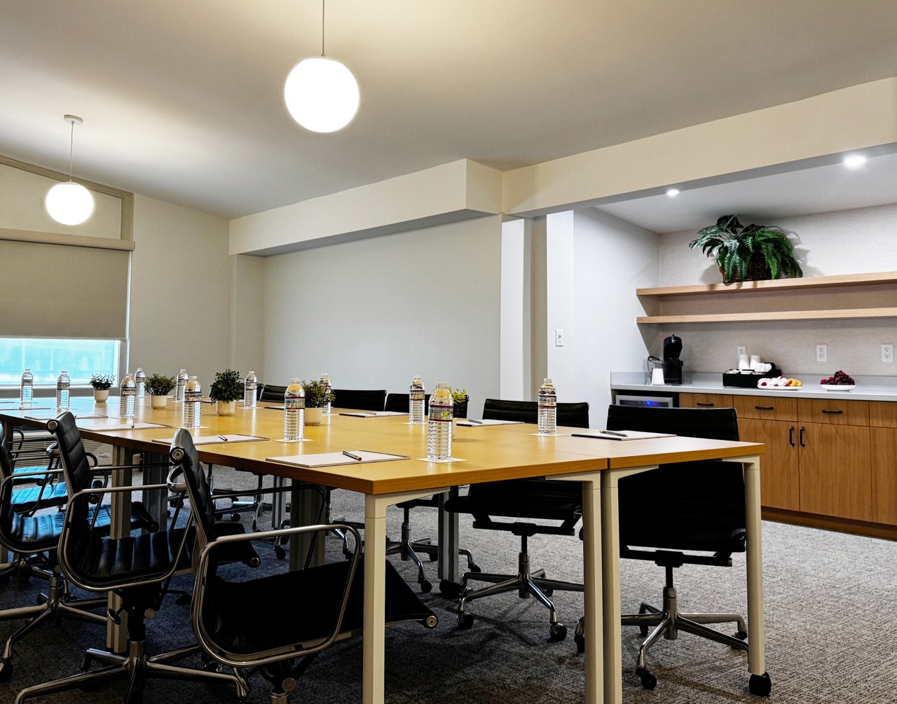 Meeting room with large conference table in the center