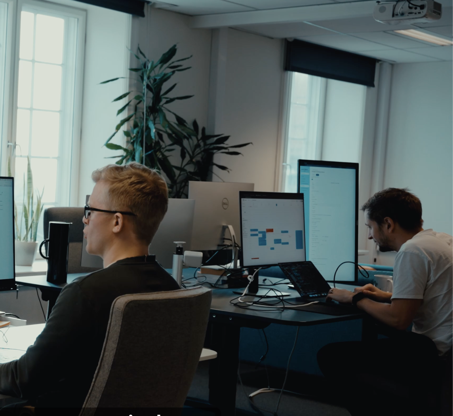 Two Nimbus Library founders in a minimalist office, showcasing the professional and versatile use of the library.