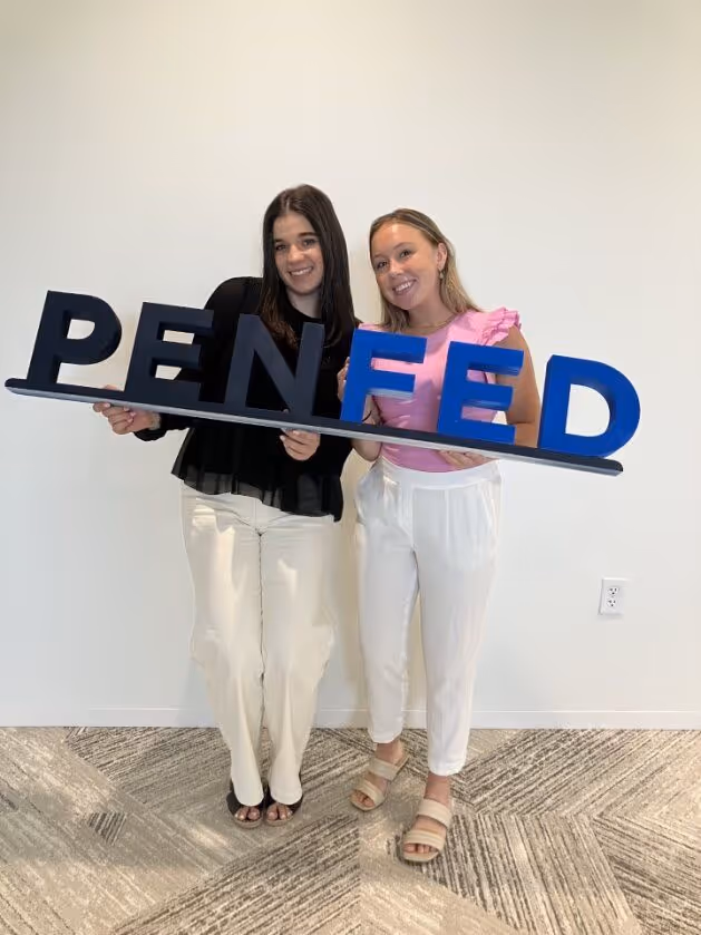 PenFed teammates cheering at an event