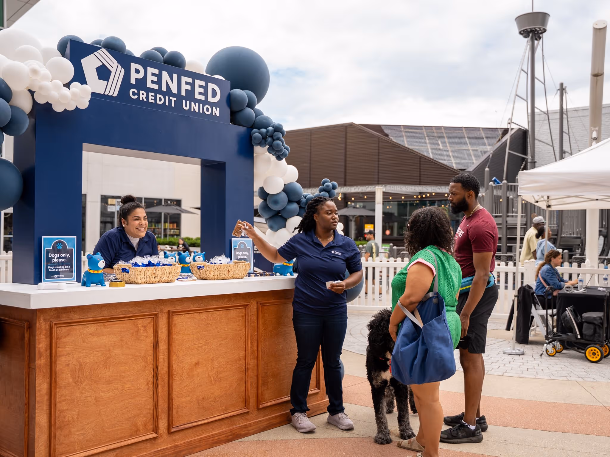 PenFed teammates smiling during an office gathering