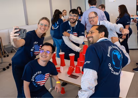PenFed Worker standing next to a dog mascot at an event