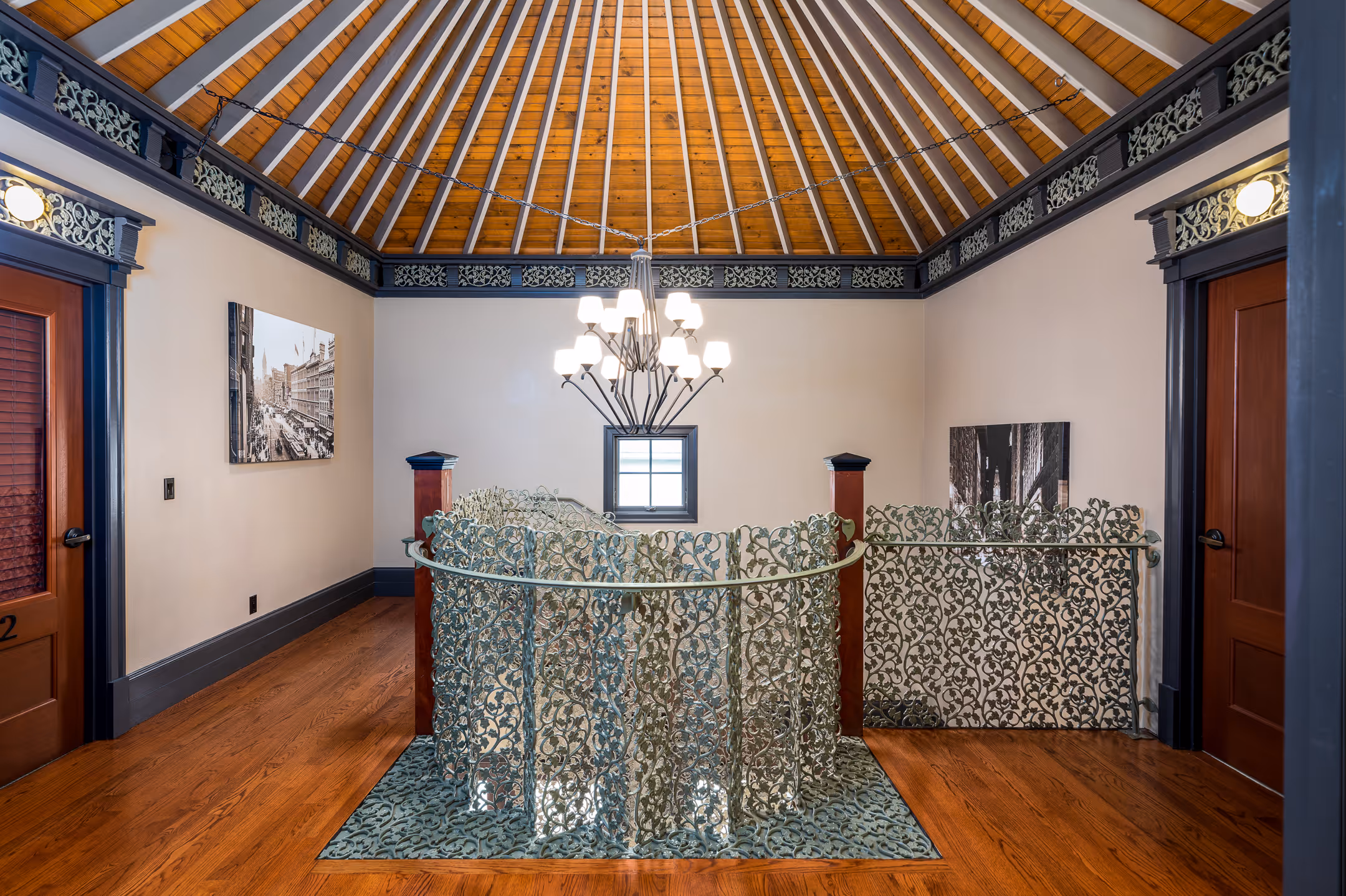 A beautiful interior design image of a stairwell with a decorative ceiling.