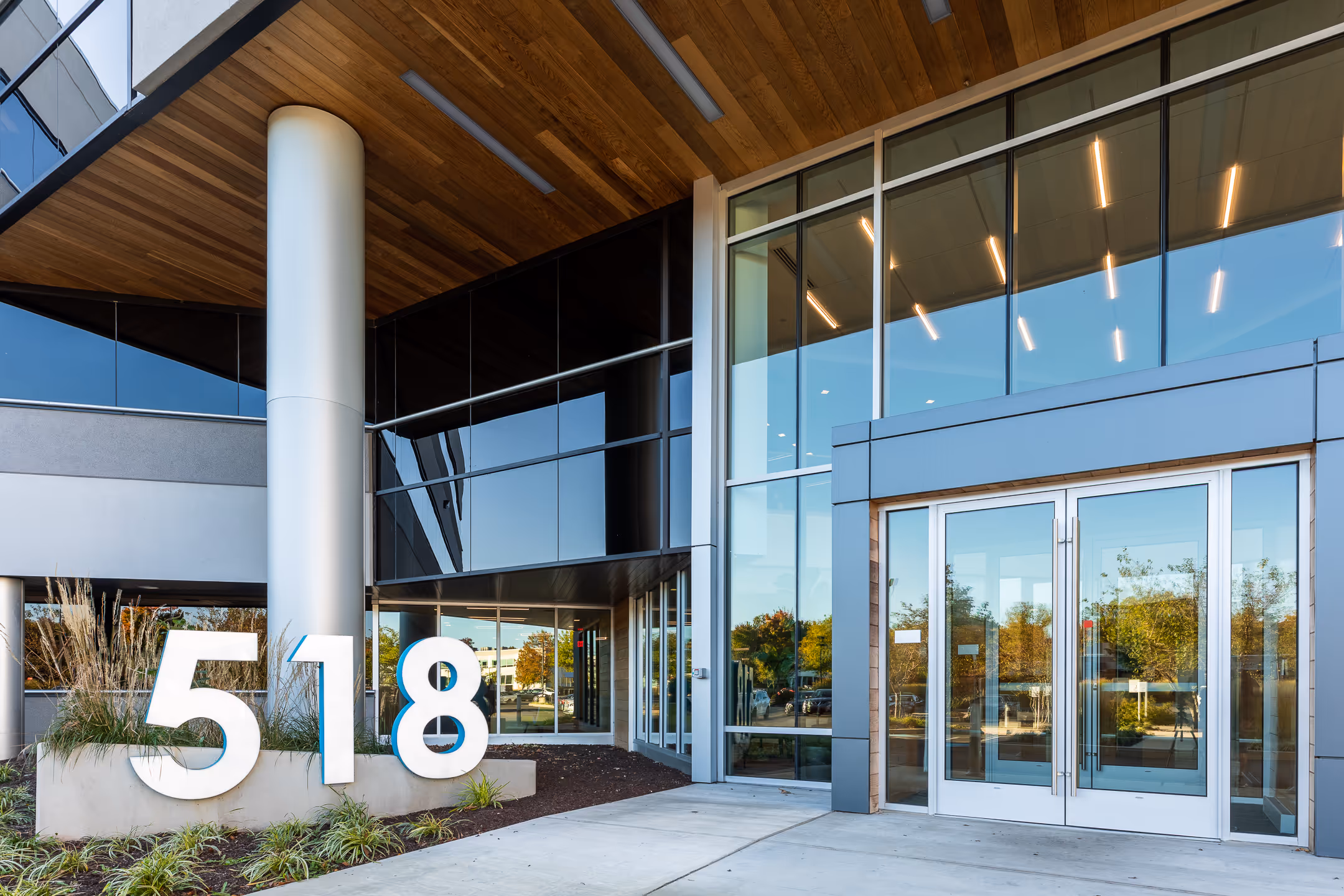 An architectural image of the front of a corporate building.