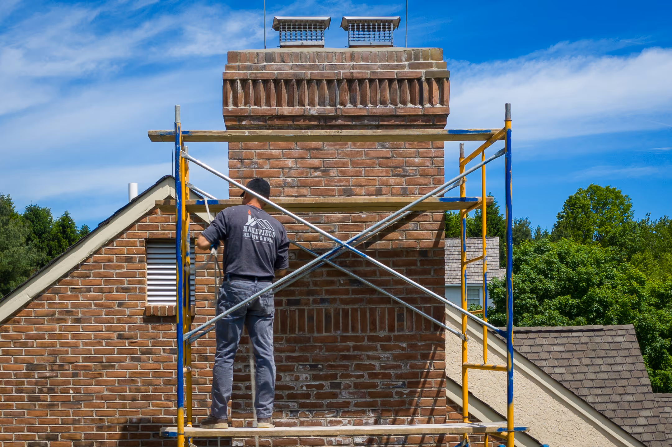 An image of Paul from Makefield Hearth working on chimney masonry.