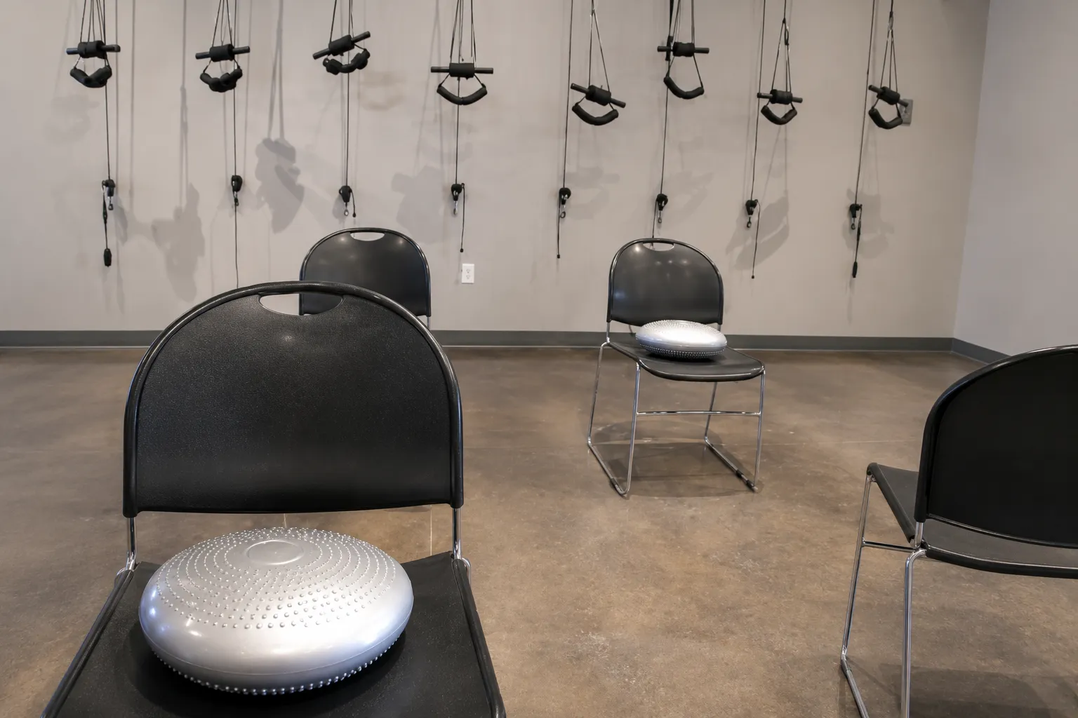 Treatment room at a chiropractor in Bee Cave with balance cushions and rehabilitation equipment.